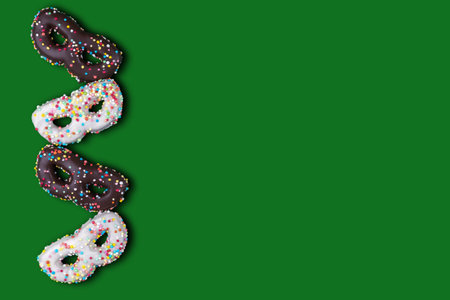 Flat lay of greeting card for carnival or birthday with cookies in the shape of a mask.の写真素材