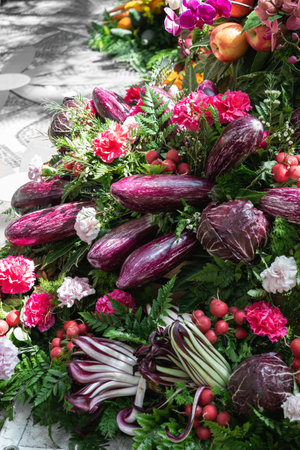 Assortment of freshly picked vegetable and red apples, eggplant, radishes, red lettuce, radicchio.の写真素材