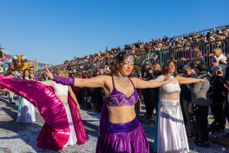 Menton, France-February 12, 2023: traditional carnival parade of Lemon Festival in colorful costumes.のeditorial素材
