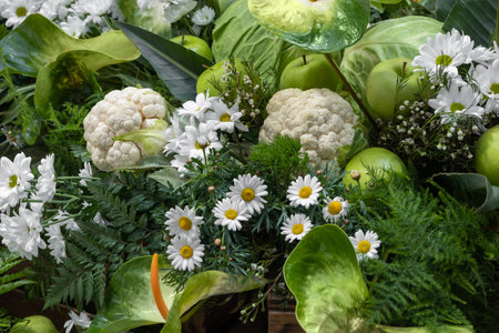 Flat lay and close-up assortment of freshly picked vegetable cauliflower and green apples.の写真素材