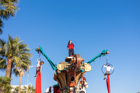 Menton, France-February 12, 2023: Artists on traditional carnival parade of Lemon Festival.
