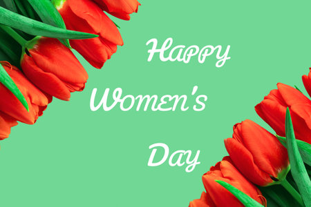 Close up of red tulips on green background with happy womens day message.