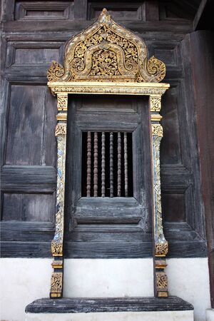wooden window of Thai templeの写真素材