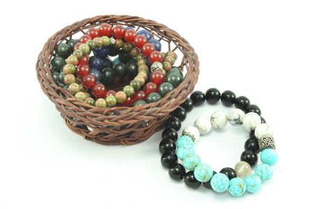 beautiful accessory stone bracelet in basket isolated backgroundの写真素材
