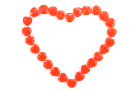 heart symbol made of sweet candy isolated on white backgroundの写真素材