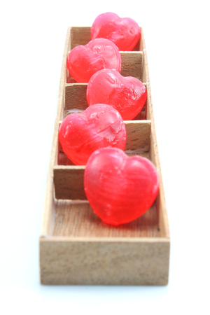 Candy Hearts in wood boxの写真素材