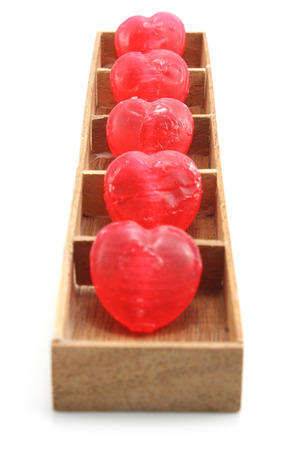 Candy Hearts in wood boxの写真素材