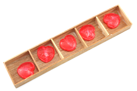 Candy Hearts in wood boxの写真素材