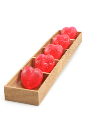 Candy Hearts in wood boxの写真素材