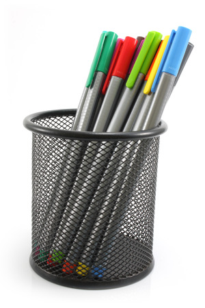 colored Pens  in iron basket on the white backgroundの写真素材