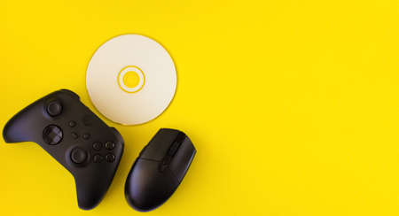 Gamer flat lay. Gaming accessories on yellow background with copy space.Gamer gadgets.