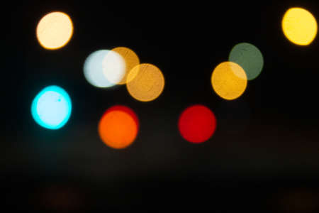 Boke. Photo without focus. Lights on a black background. Defocused Image Of Illuminated Lights At Nightの写真素材