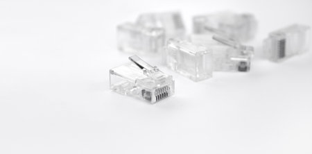 bunch of internet connectors on a white background.RJ-45 connector. Twisted pair cable.の写真素材