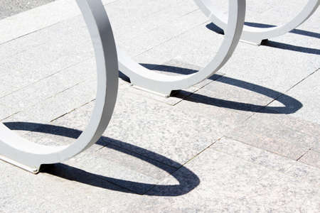 Empty bike parking. Parking space or spot for multiple bikes. Place for parking at the house or shop of bicyclesの写真素材