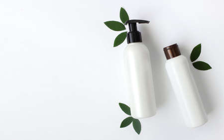 Mockup of white empty cosmetic bottles on white background.Copy space, Top View.の写真素材