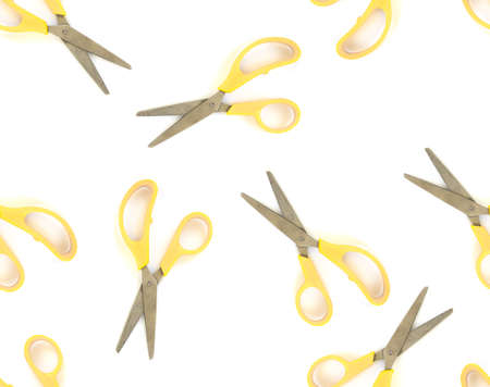 Seamless pattern yellow scissors on white isolated backgroundの写真素材