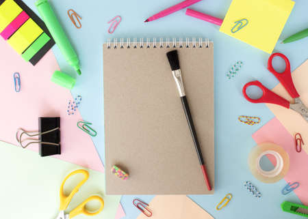 Different stationery on multicolored colorful background, flat lay with space for text. Back to schoolの写真素材