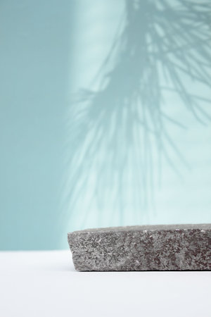 empty piece of gray stone podium minimalism on emerald background. Copy space, place for text,...