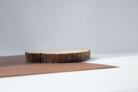 empty piece of wood podium minimalism on grey background. Copy space, place for textの写真素材