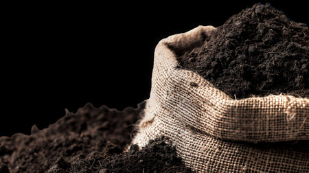 Rich Dark Soil in Rustic Bag for Gardening and Agriculture on Transparent Background. High quality photoの素材