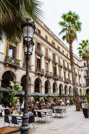 Barcelona Spain September 2021. One of the most beautiful tourist spots in Barcelona with many cafes and palm trees is the Royal Plaza Real. Beautiful city. Nice walks along the narrow old streetのeditorial素材