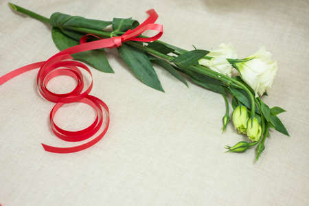 A bouquet of white flowers as a gift for girls on the spring holiday.