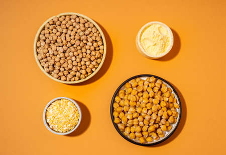 Chickpeas in small yellow ceramic plate bowl isolated on beige background.vegetarian dish. style minimalism. on bowl close up - concept healthy vegan diet protein organic food dishの写真素材