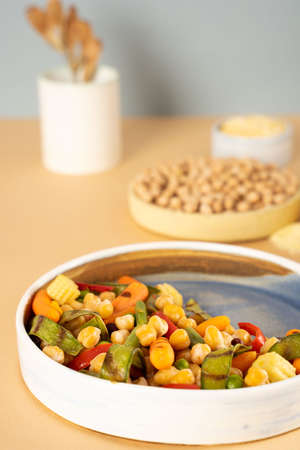 Homemade vegetarian stewed chick-pea chickpeas with vegetables. Style minimalism. Selective focus. On plate bowl close up. Concept healthy vegan diet protein organic food dishの写真素材