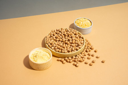 Chickpeas in small yellow ceramic plate bowl isometric projection diagonal beige and blue background. vegetarian dish. style minimalism. on bowl close up - concept healthy vegan diet protein organic brain food dishの写真素材