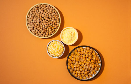 Chickpeas in small yellow ceramic plate bowl isolated on beige background.vegetarian dish. style minimalism. on bowl close up - concept healthy vegan diet protein organic brain food dishの写真素材