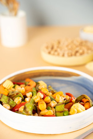 Homemade vegetarian stewed chick-pea chickpeas with vegetables. Style minimalism. Selective focus. On plate bowl close up. Concept healthy vegan diet protein organic food dishの写真素材