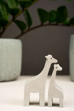 figurine toy animal handmade concrete and plaster mom and baby giraffe for playing with children and minimalistic decor and home decoration. Zoo.の写真素材