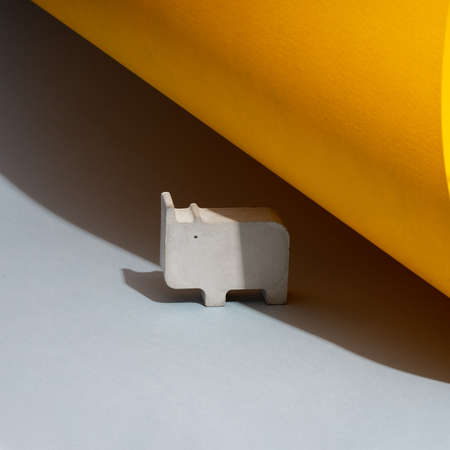 Creative diagonal Composition with concrete pink flower pot. on a blue background. Minimalism. Natural material. DIY. Eco-friendly. Stop plastic.の写真素材