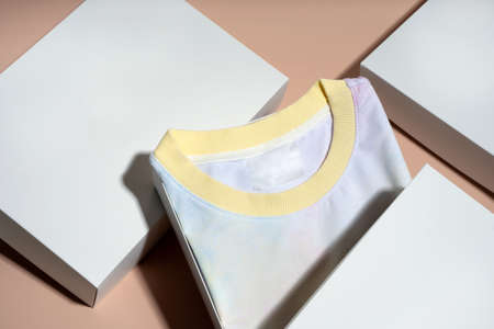 Pink Yellow Blue tie dye floating flying women's hoodie and white gift box on pink background. Creative clothing concept, trendy. fashion autumn spring discounts. black Friday. blue monday Shopping.の写真素材