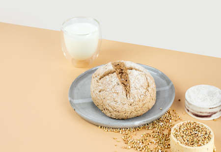 Isometry diagonal projection creative beige background with green buckwheat bread nd organic...
