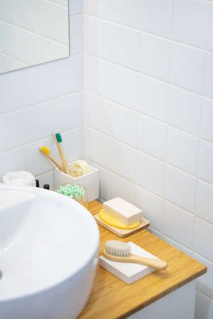 bamboo countertop and white sink in a modern bathroom with eco-friendly products. Zero waste and sustainable lifestyleの写真素材