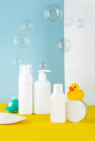 Rose flowers with aromatherapy essential rose oil in a glass bottle over very peri background. wellbeing concept.の写真素材