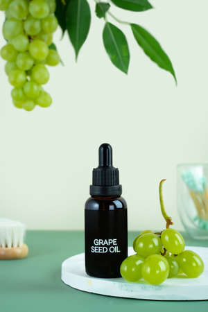 Organic bio grape cosmetics. Extract, grape seed oils, serum. Grapes are a powerful antioxidant. Healthy skin, hair, facial and body care. SPA and selfcare wellness concept.の写真素材
