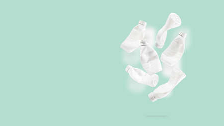 Plastic PET bottles, recycling symbol flying on a blue background. Plastic bottle fly and floating in the air. The idea of environmental sustainability. Concept of safety from environmental damage.の写真素材