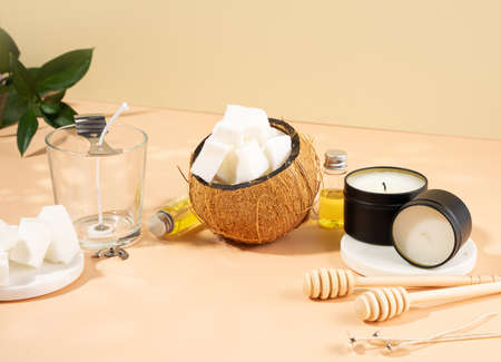 Set tools for homemade natural eco-friendly soy wax candles, wick, perfume, essential oil on a marble table. making process. trendy DIY. Craft hobby, small business, artisan products concept.の写真素材