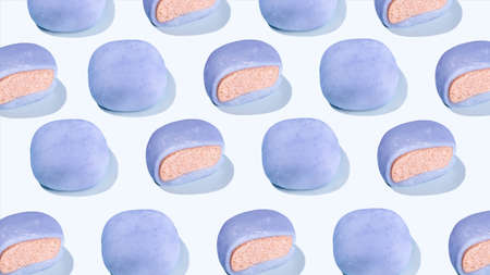 Japanese rice cakes float in the air. A conceptual composition of flying mochi and green palm leaves on a pink background. Asian cuisine, Asian sweet street food desserts. concept creative food.の写真素材