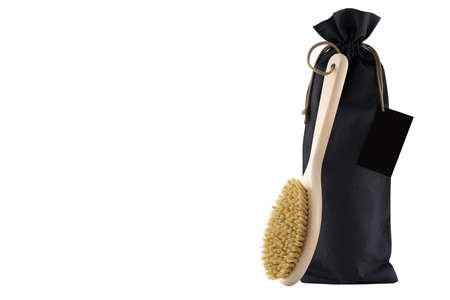 Detangler hair brushes, bottle of shampoo and hair oil float on white. Concept photo of accessories for the care and health of the head skin and hair. Creative modern image on a light gray background.の写真素材