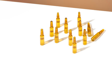 Male hands holding cosmetic ampoules with serum for hair growth, beauty hair restoration in a modern bright bathroom. Concept Hair loss, the problem of male baldness. lifestyle.の写真素材