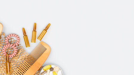 Male hands holding cosmetic ampoules with serum for hair growth, beauty hair restoration in a modern...