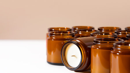 Group of Handmade Soy and coconut wax candles in a Amber and opaque container, brown glass jar. Natural eco friendly organic candles. Concept sustainability and vegan plastic free product. copy spaceの写真素材