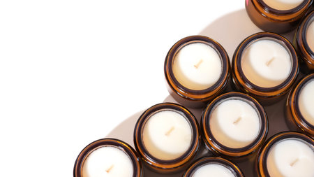 A set of different aroma Soy wax Scented candles in brown glass jars. Natural essential candles in a...