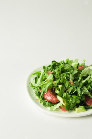 healthy vegan avocado and beet salad in white bowl, top viewの写真素材