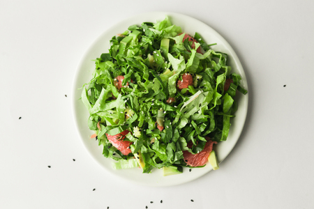 healthy vegan avocado and beet salad in white bowl, top viewの写真素材