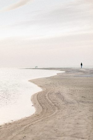 and surface on the beach, wavy sand on the oceanの写真素材