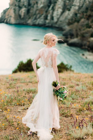 Stunning bride in beautiful wedding dress on natural background.の写真素材